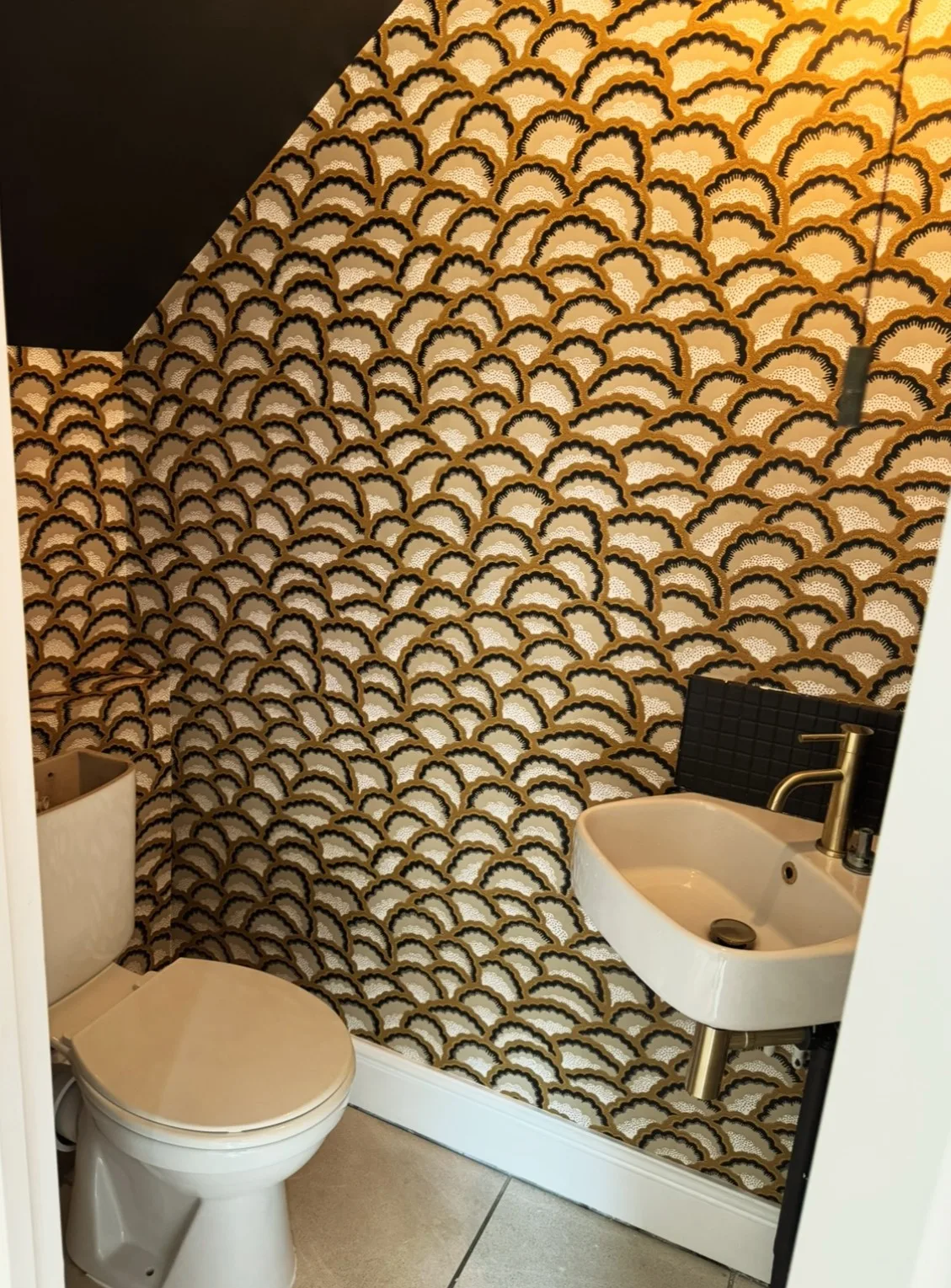 Modern bathroom with bold geometric patterned walls