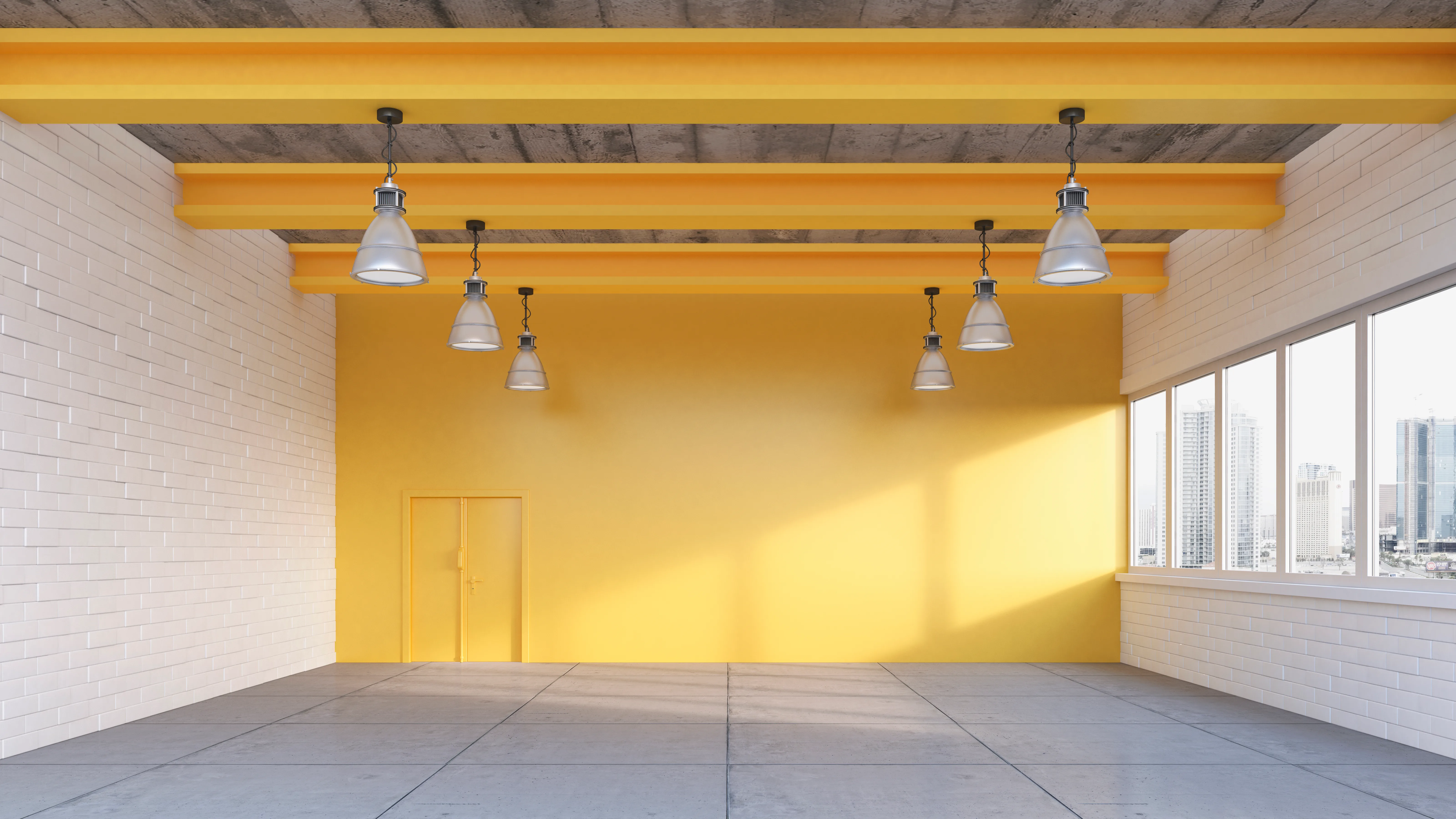 Bright interior space featuring yellow painted walls and concrete ceiling beams with pendant lighting