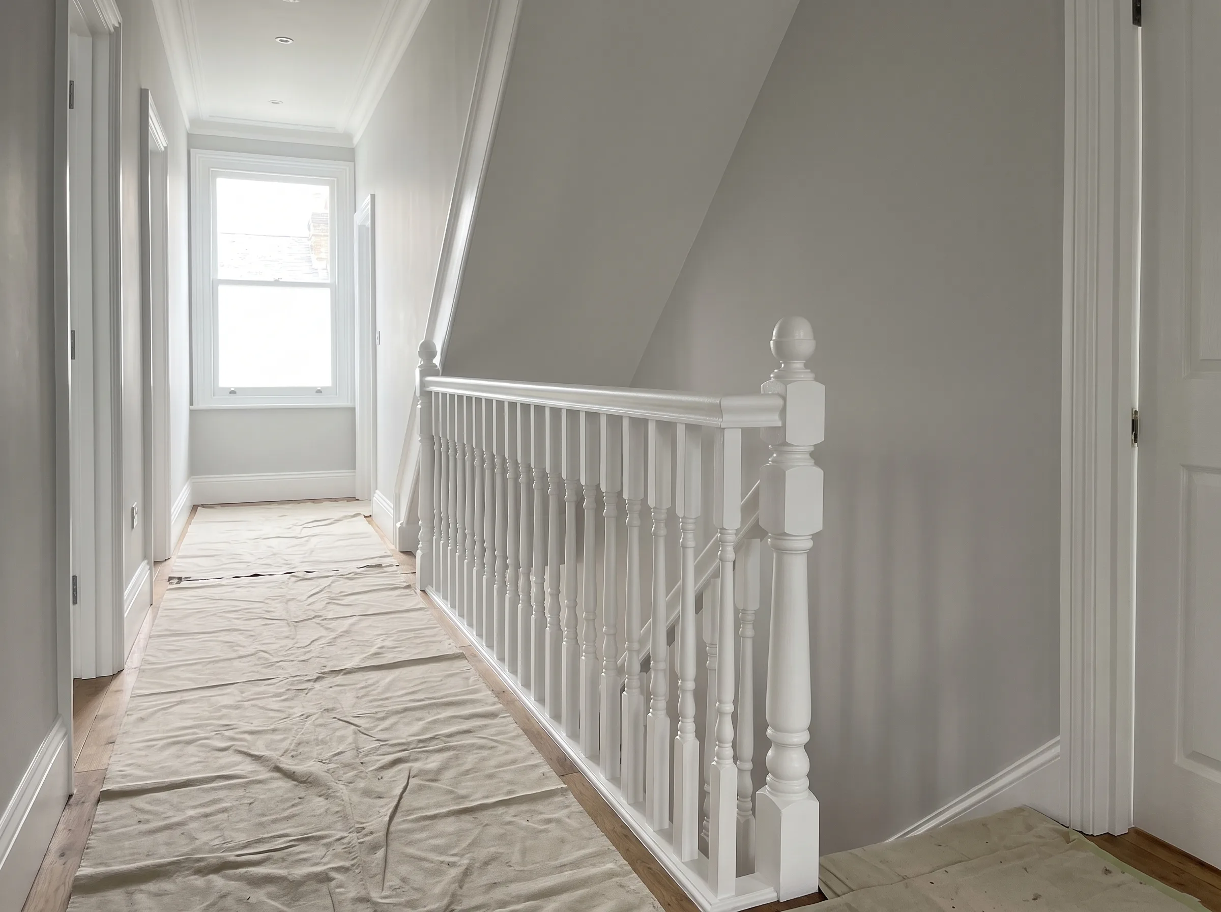 Bright hallway with freshly painted white woodwork and a clean, minimalistic design