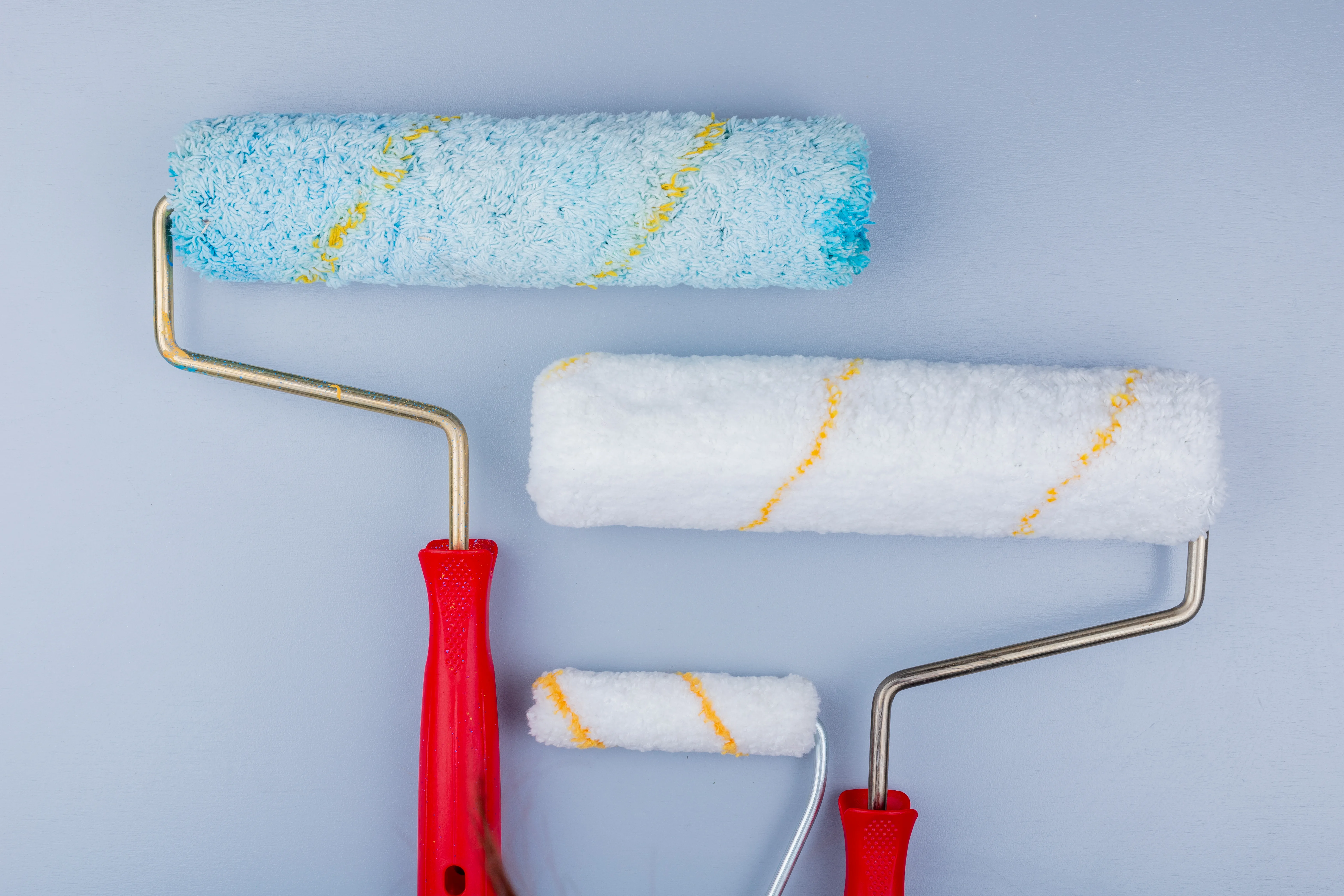 Close-up of paint rollers in different sizes, ready for use in painting services